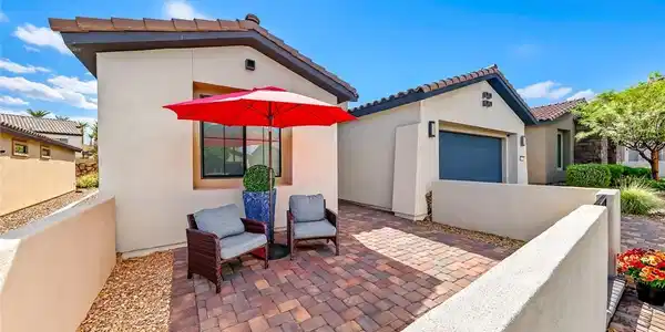 Image 3: An inviting stone-paved courtyard sits beautifully