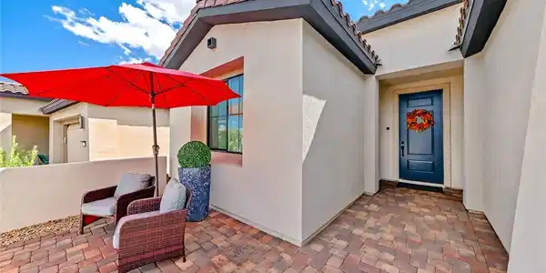 Image 4: A welcoming paver courtyard leads directly to the