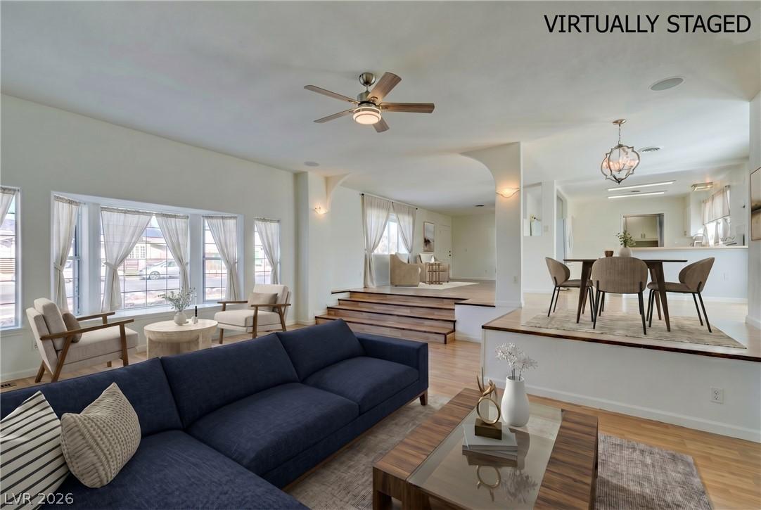 Image 2: Sun-filled living space with an open-concept layou