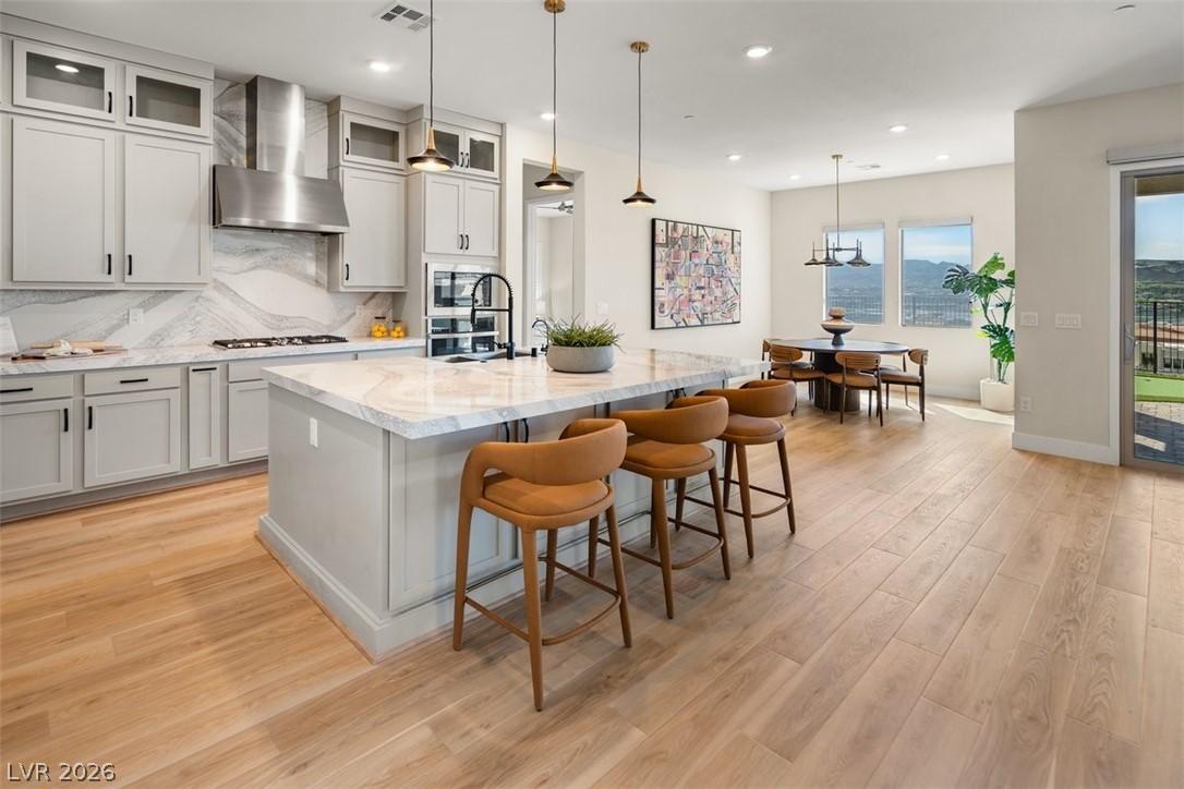 Image 4: Kitchen featuring decorative backsplash, glass ins