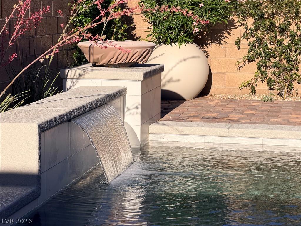 Image 3: A tranquil cascade spills into a sparkling pool, b