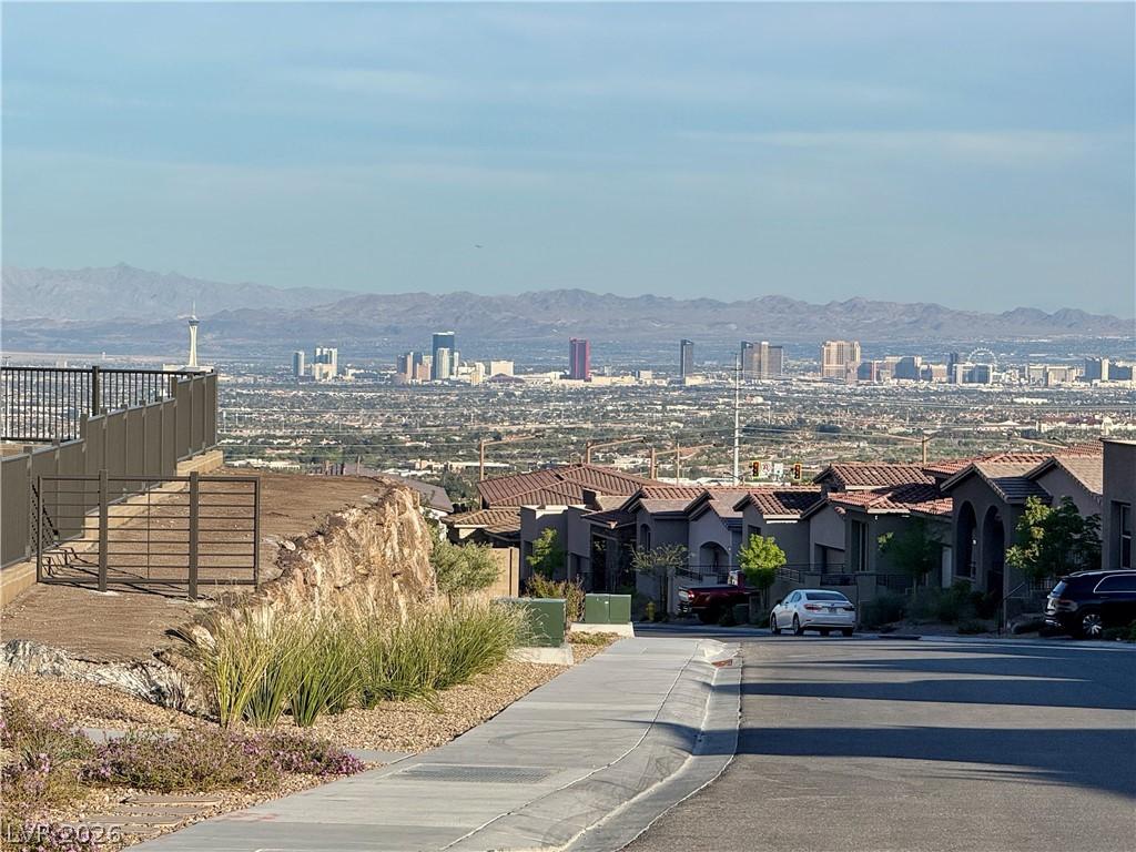 Image 4: Panoramic city views and distant mountains define