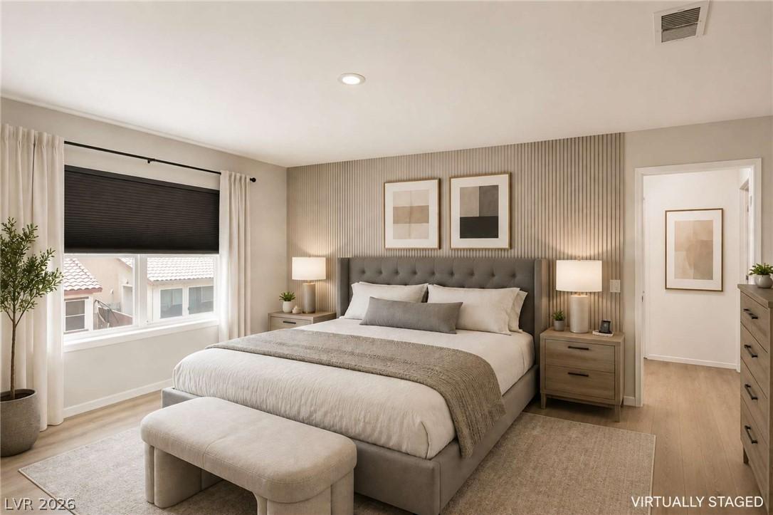 Image 4: Elegant primary bedroom offers recessed lighting a