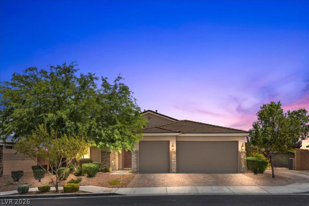 Image 1: A desert oasis welcomes you with a paved driveway