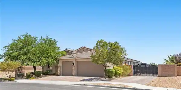 Image 2: A well-maintained residence boasts an inviting fro