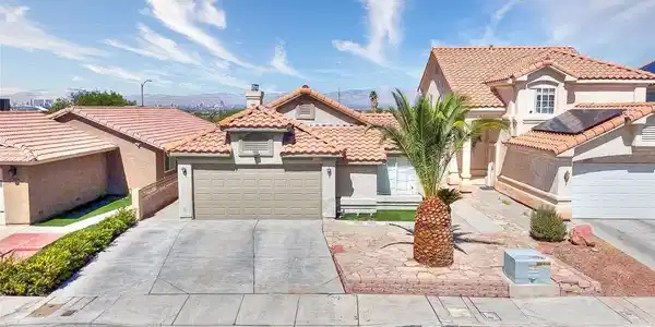 Image 3: Spanish tile roofing and a concrete driveway defin