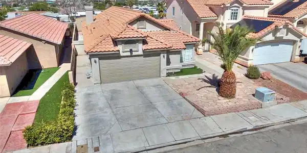 Image 4: Classic tile roofing and a spacious concrete drive
