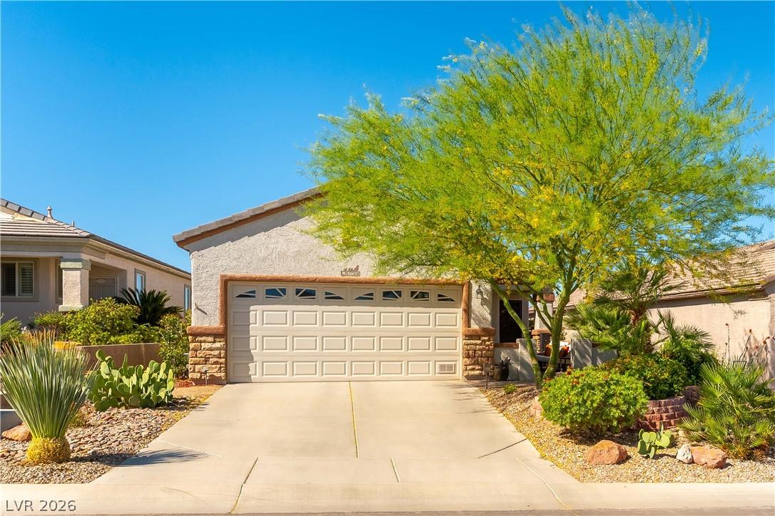 Image 2: A desert-inspired landscape complements this home'