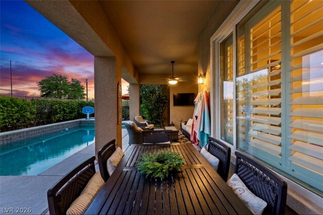 Image 4: An inviting covered patio with a dining area and a