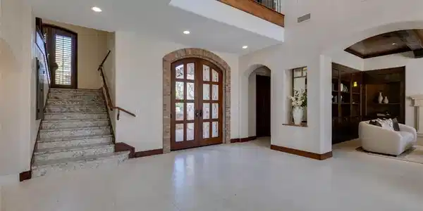 Image 3: Grand entryway with high ceilings, an elegant stai