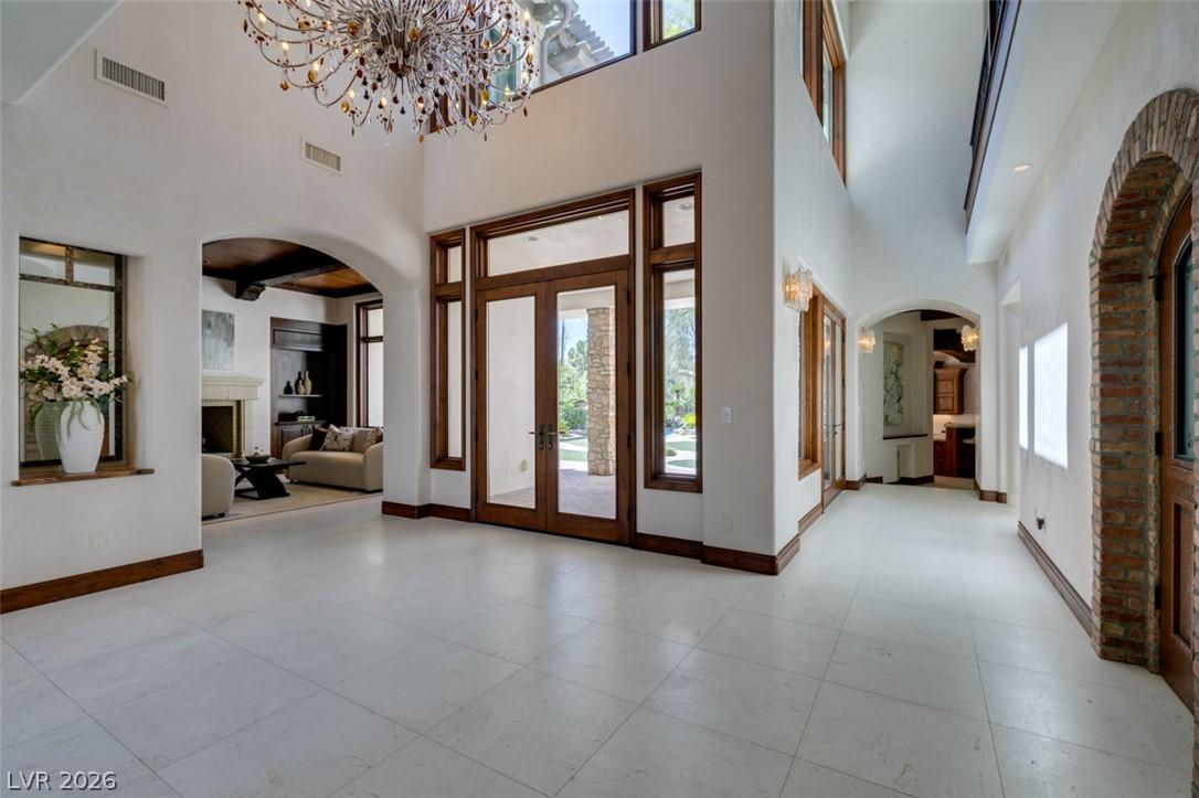 Image 4: A grand entrance with high ceilings and light floo
