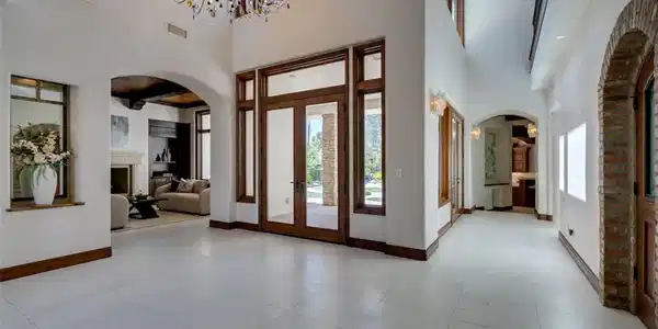 Image 4: A grand entrance with high ceilings and light floo