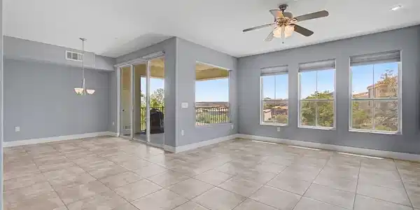 Image 4: Tile flooring extends throughout this generous liv