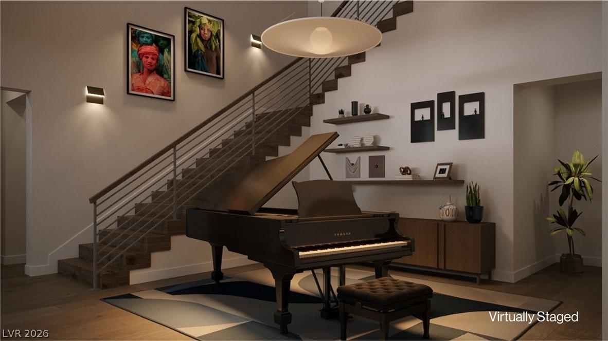 Image 3: A grand piano elegantly anchors this refined entry