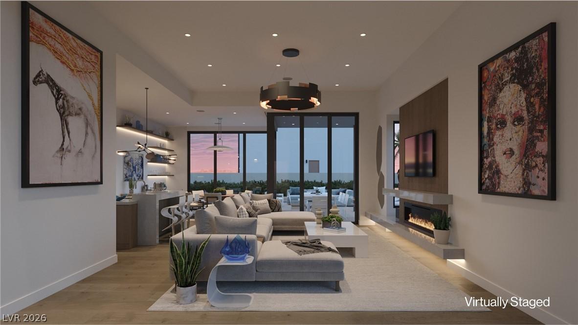 Image 4: An open-concept great room with a gas linear firep