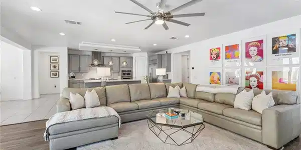Image 4: An inviting open-concept living area boasts recess