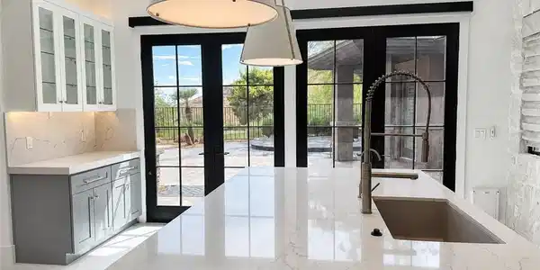 Image 4: Double glass doors frame garden views from this co