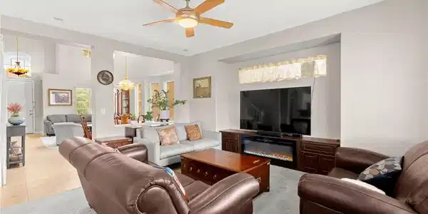 Image 4: An open floorplan connects the cozy living area to