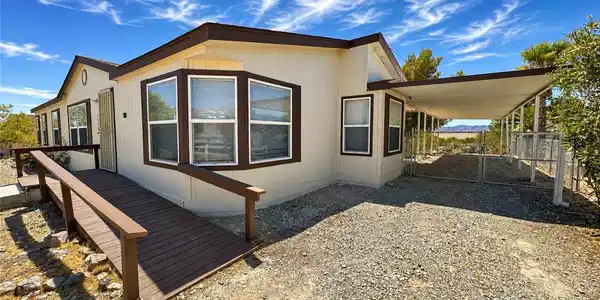 Image 2: A ramped entry welcomes you to this desert home fe