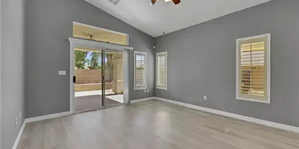 Image 2: Sliding glass doors open directly to the covered p