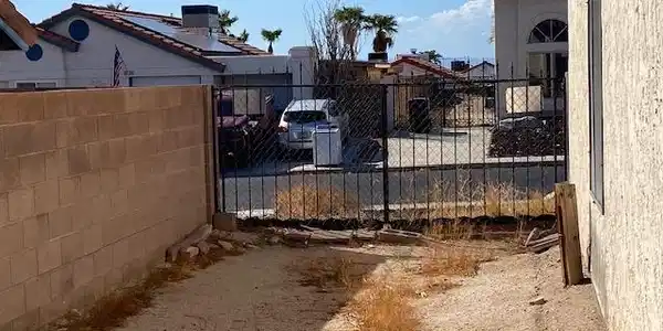 Image 2: Secure gated side yard offers excellent potential