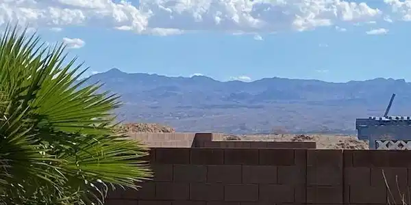 Image 4: Distant mountain ranges rise behind a sturdy block