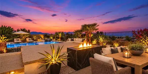 Image 2: An inviting backyard oasis centers around a custom