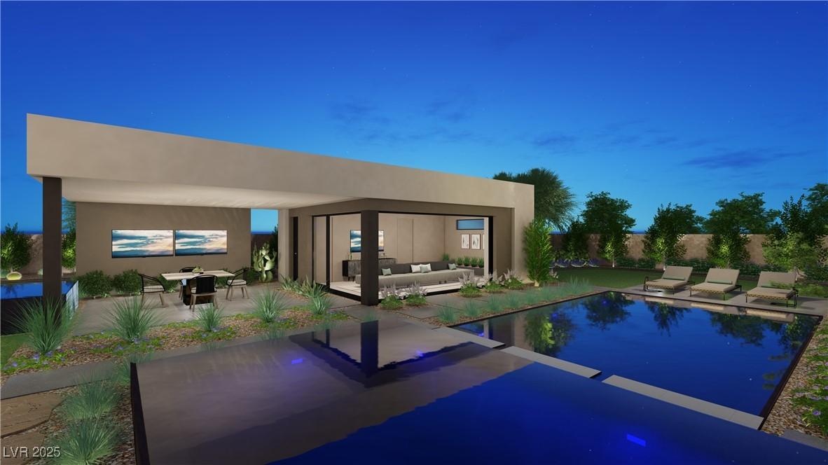 Image 3: Pool at dusk with an outdoor pool and a patio