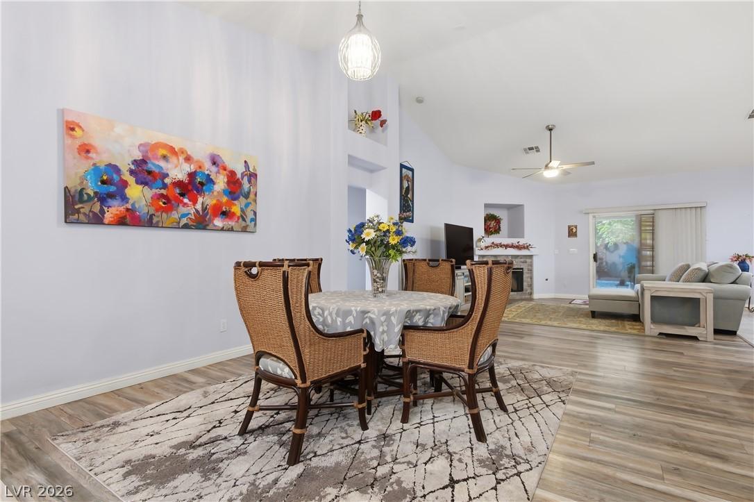 Image 3: This bright interior features vaulted ceilings and