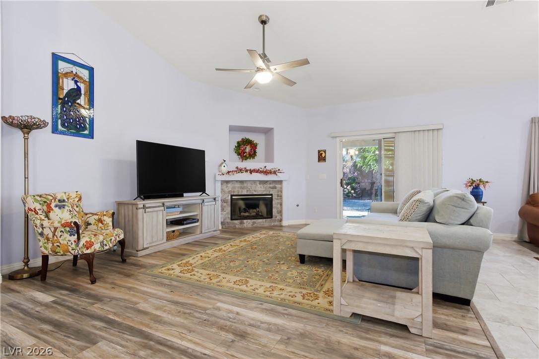 Image 4: This inviting living room offers abundant natural