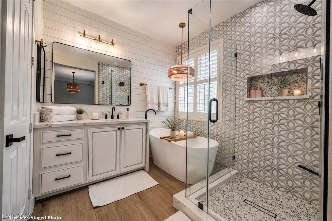 Image 2: Elegant bathroom offering a freestanding tub, slee