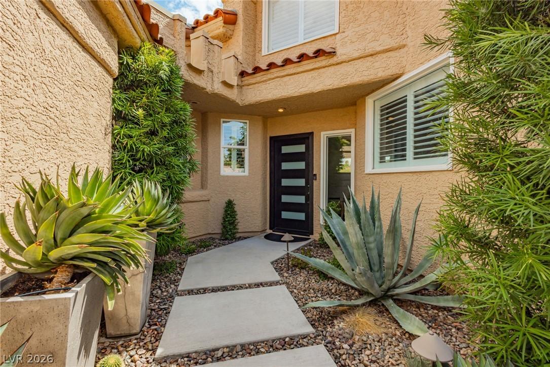 Image 3: A striking modern entryway featuring a segmented c
