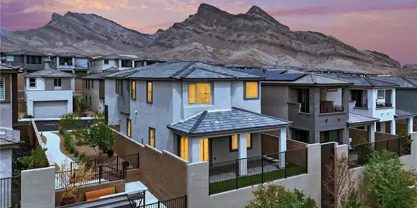 Image 3: Dramatic mountain peaks provide a striking backdro