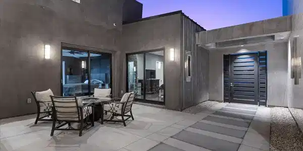 Image 2: An inviting private courtyard features sleek concr