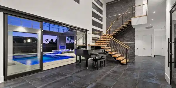 Image 3: A grand entrance with an open floor plan, featurin
