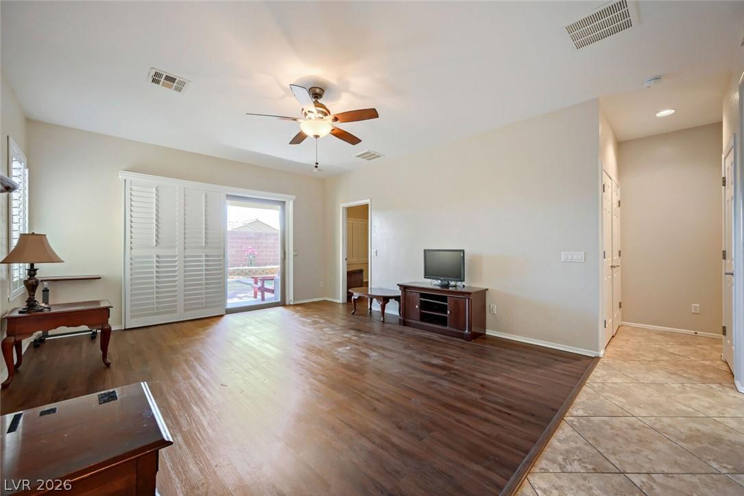 Image 4: Natural light streams into this welcoming living a