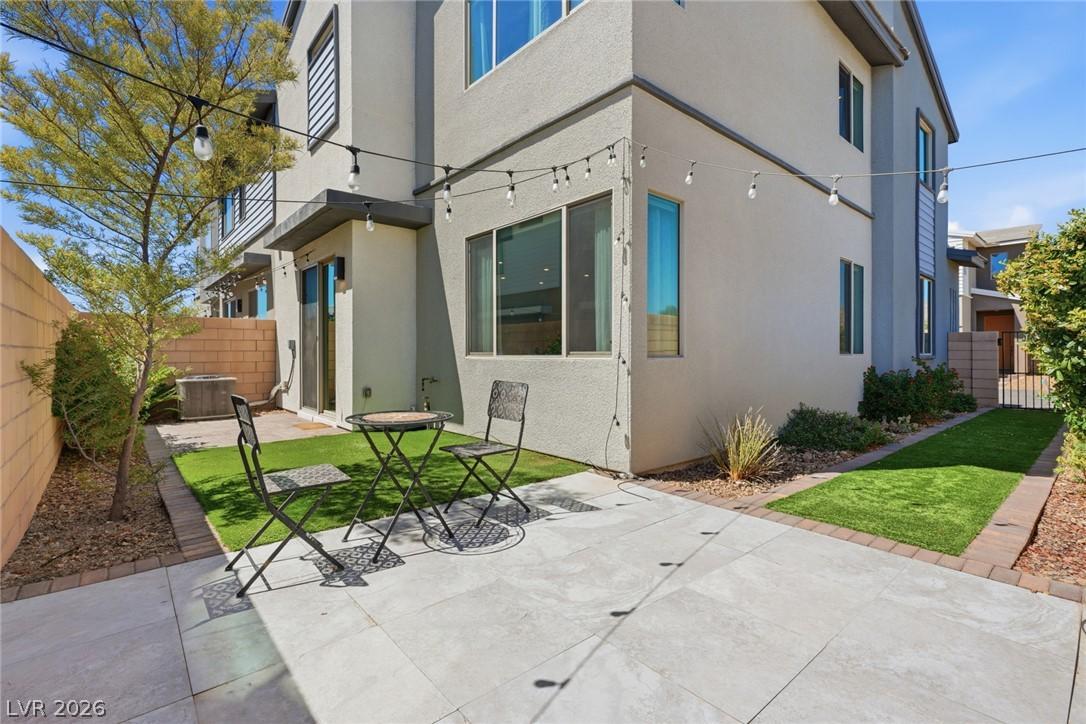 Image 2: An inviting backyard patio features ample space fo