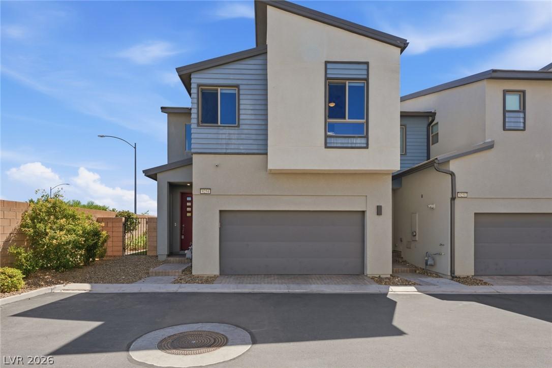 Image 4: A contemporary exterior showcasing a two-story des