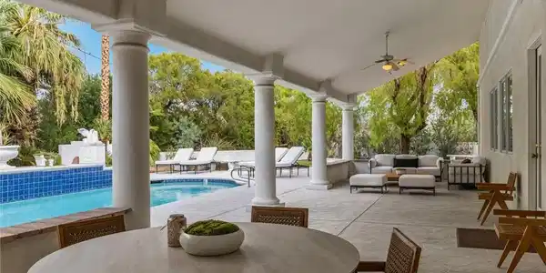 Image 4: Classical columns frame a sheltered outdoor dining