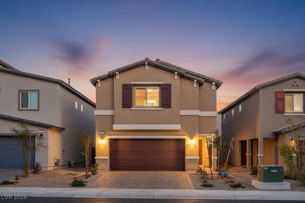 Image 1: Traditional home featuring a 2-car garage, and dec