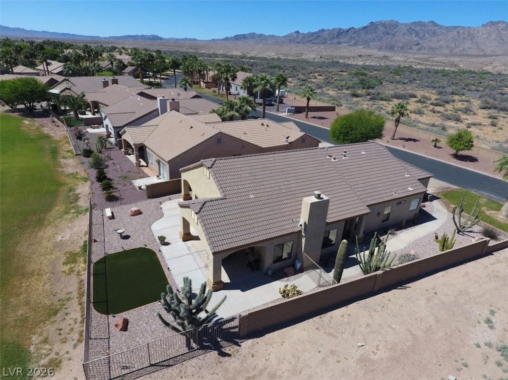 Image 2: An aerial perspective reveals a desert oasis commu
