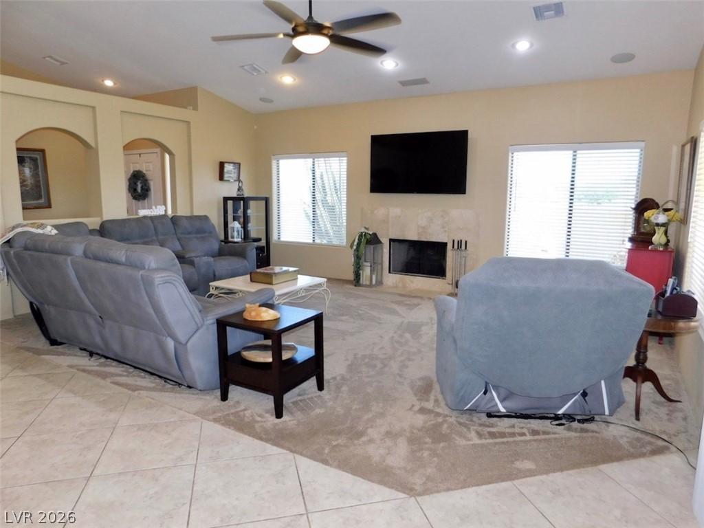 Image 4: A comfortable living room features a fireplace, va