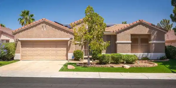 Image 2: An aerial view captures the home's exterior, offer