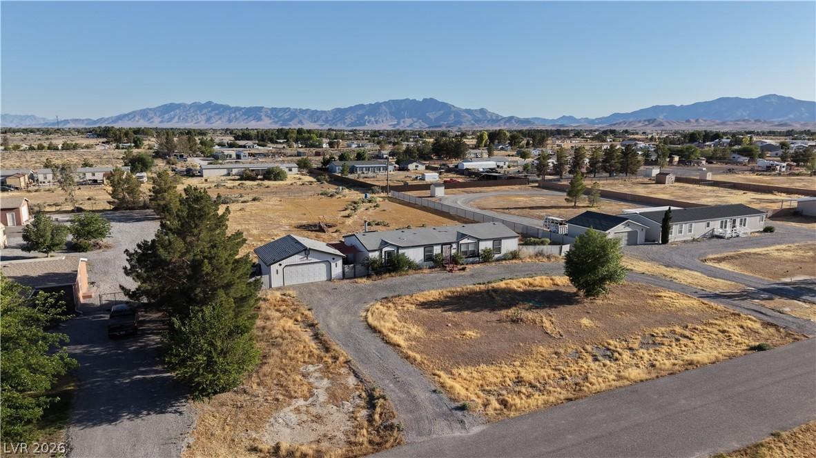 Image 3: A desert landscape property featuring a home, outb