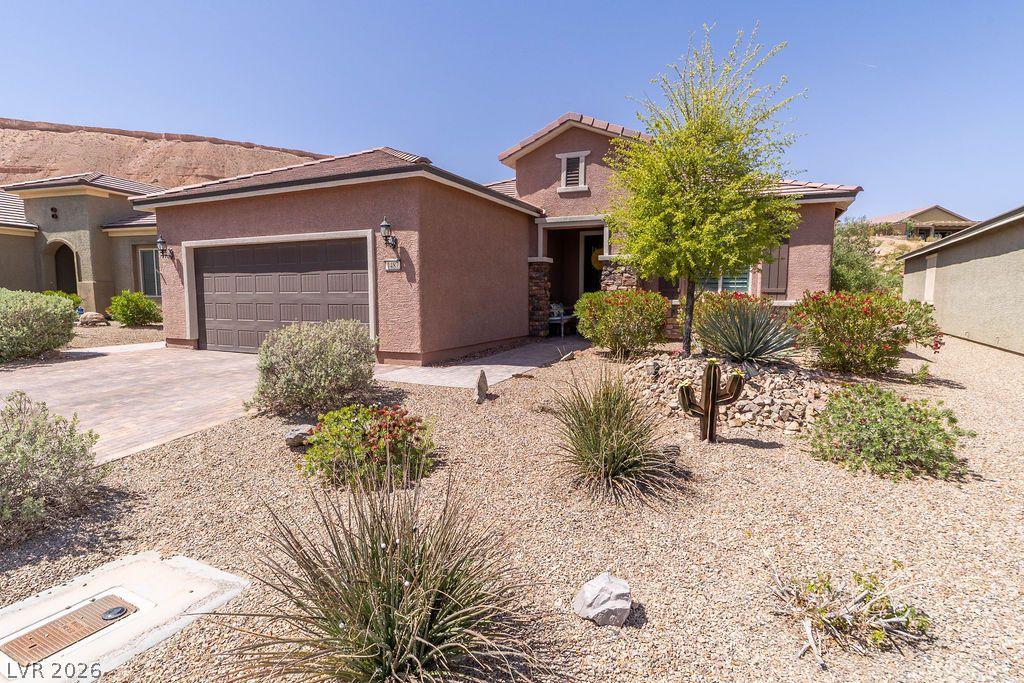 Image 2: A desert oasis welcomes you with a detached garage