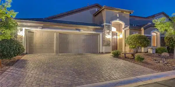 Image 3: A welcoming front entrance, featuring a brick pave