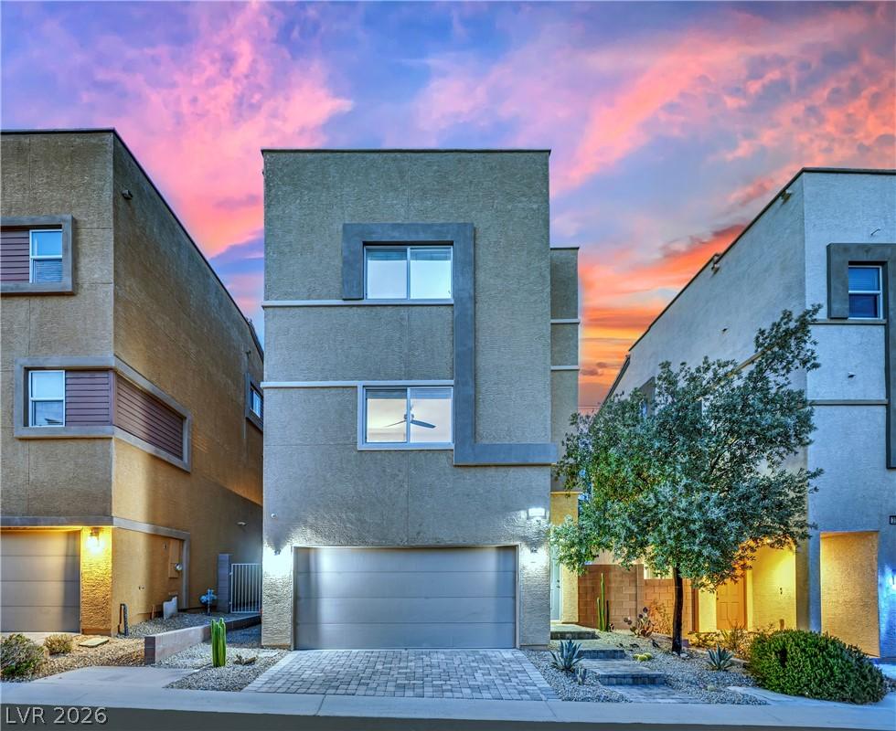 Image 2: A modern facade with architectural lines, a paved