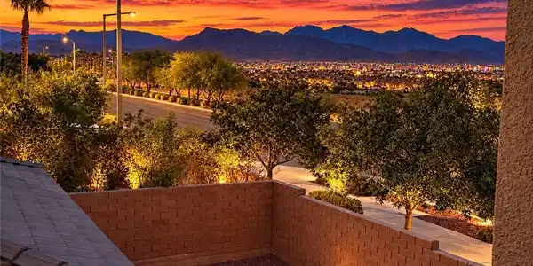 Image 2: Dramatic sunset skies frame majestic mountain and