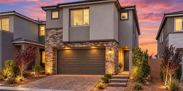 Image 4: Exquisite stone accents and a paved driveway enhan