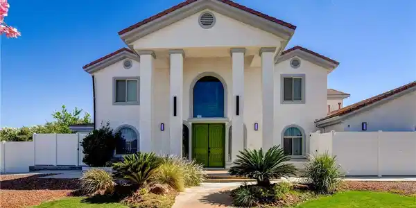 Image 2: Architectural columns and an eye-catching green en